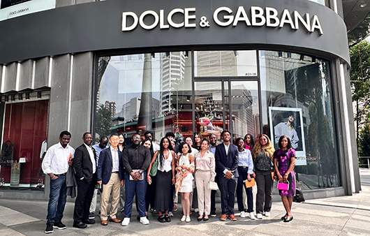 Whitman students posing outside Dolce & Gabbana