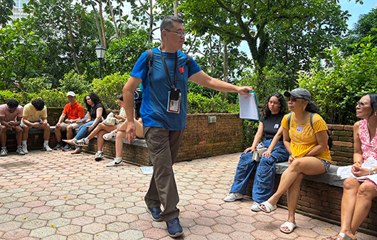 Whitman students sitting on benches at the Gardens by the bay
