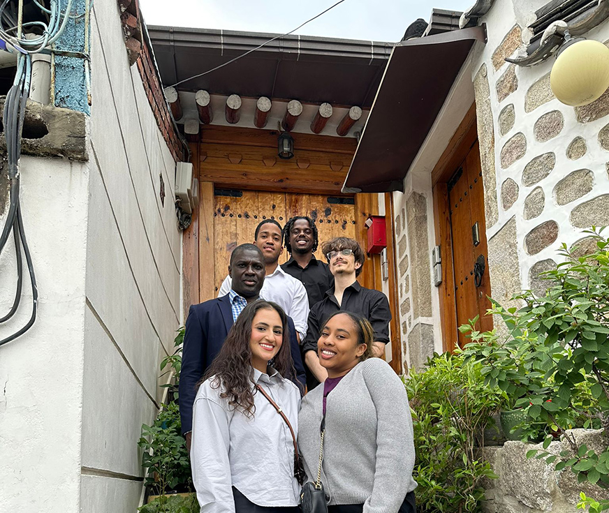 Whitman students posing outside a building