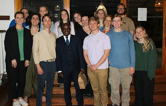 Student group posing with Fred Otieno