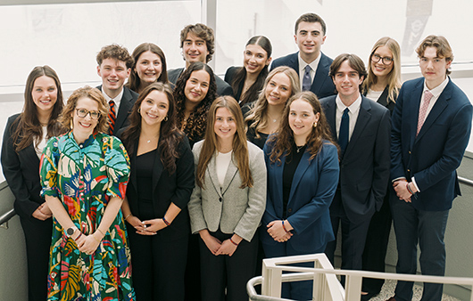 Professor Wimer posing with the team of students