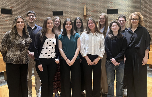 Professor Wimer posing with the students going to Kenya