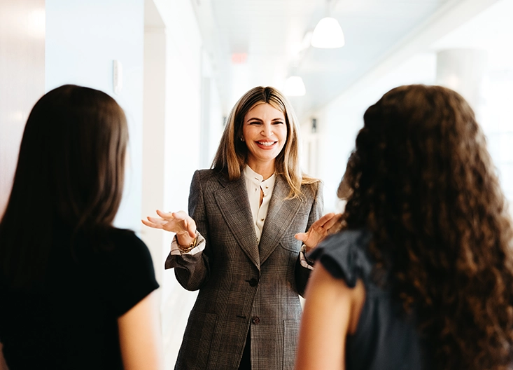 Professor talking with two students