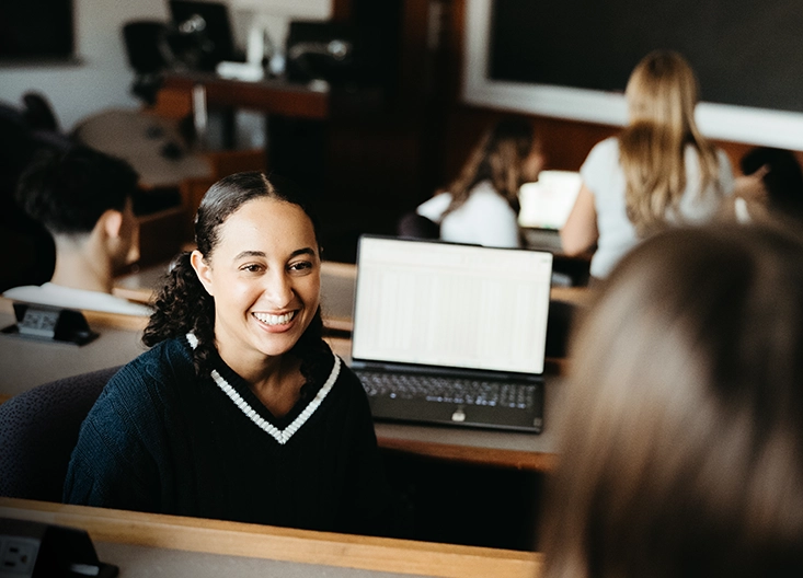 Student smiling in classroom