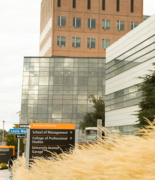 Whitman building with decorative grass in foreground