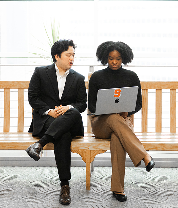 PhD students looking at laptop