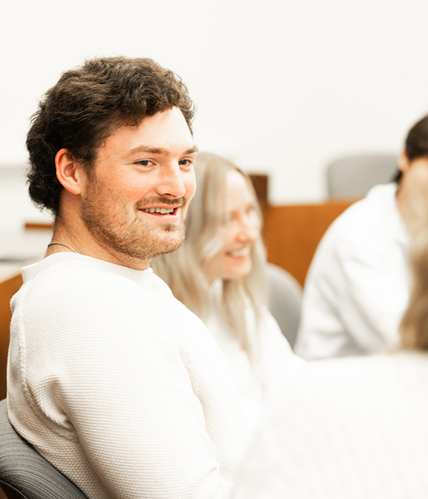 Student smiling in classroom