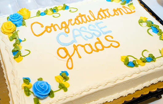 Cake decorated with flowers and Congratulations CASSE grads