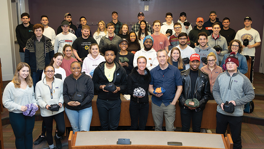 Adam and Amy Fazackerley posing with group of students in a Whitman classroom