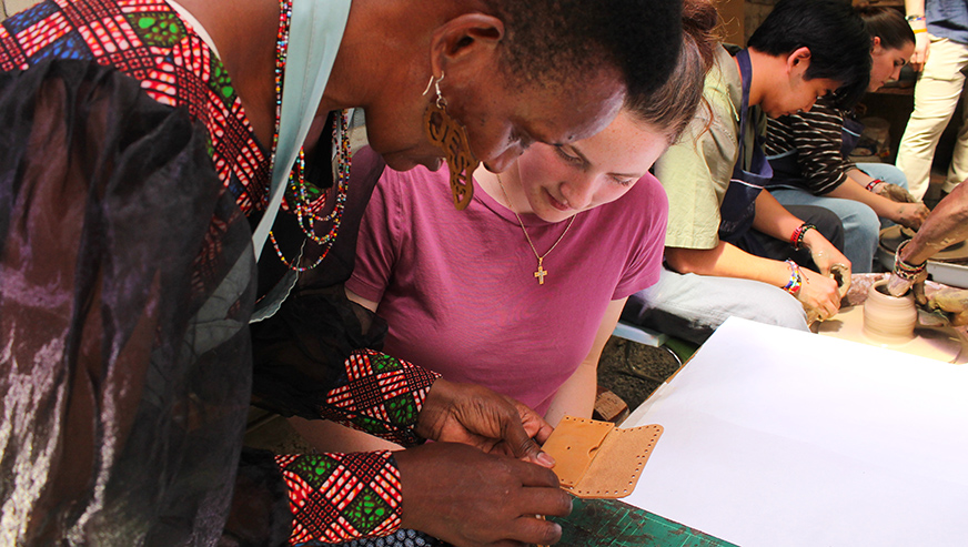 Cassandra Dasco watching refugee artisan craft