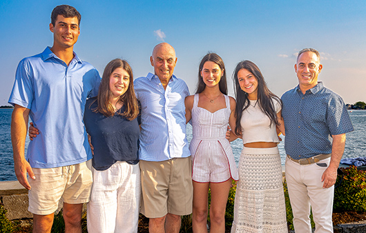 Jeff, Jacqueline, Don, Dayna, Margot and Bob Hornung in front of the ocean