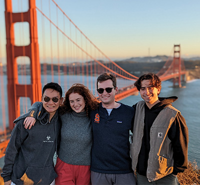 A group of students standing in front of the Golden Gate Bridge