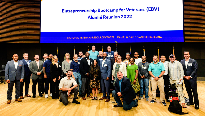 A group poses for a photo at the Entrepreneurship Bootcamp for Veterans Alumni Reunion