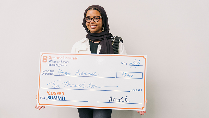 Yasmin Madmoune posing with her winning check