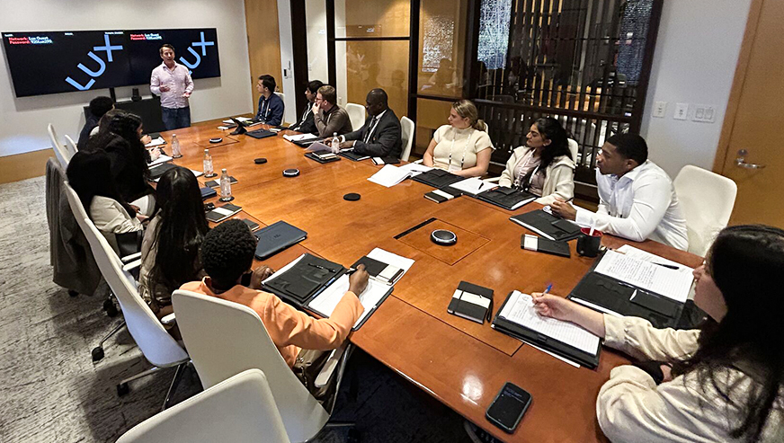 Students at boardroom table - LUX