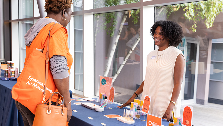 Kora-Lynah Abelard tabeling her company products