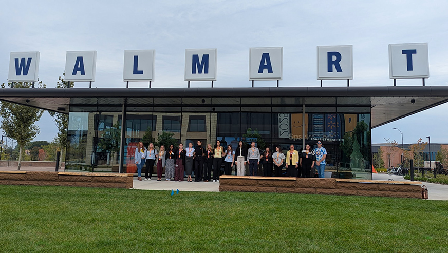 Walmart_trip_2026_872x493 Students posing under Walmart sign