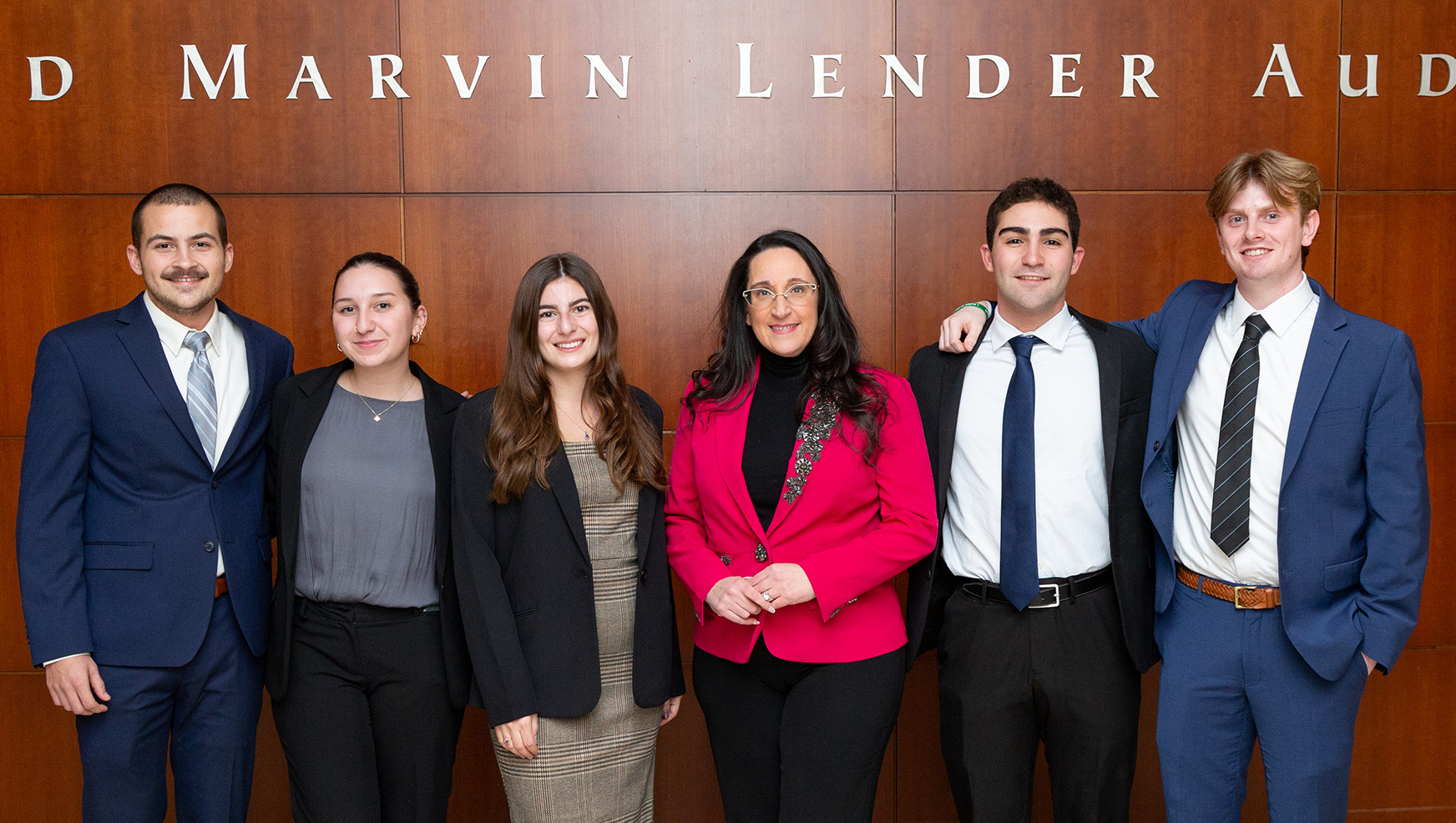 Winning Fall 2023 Capstone team posing with their mentor Marie Adornato