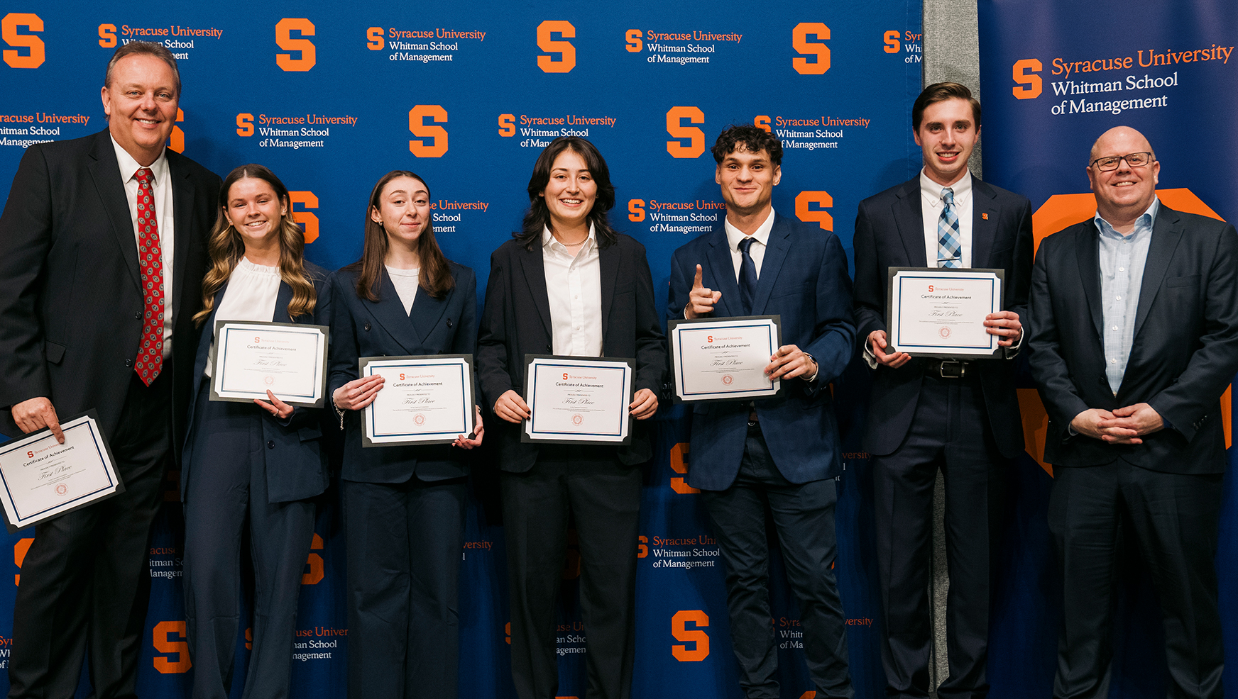 Winning Capstone team posing with Professor Walsleben and Interim Dean Alex McKelvie