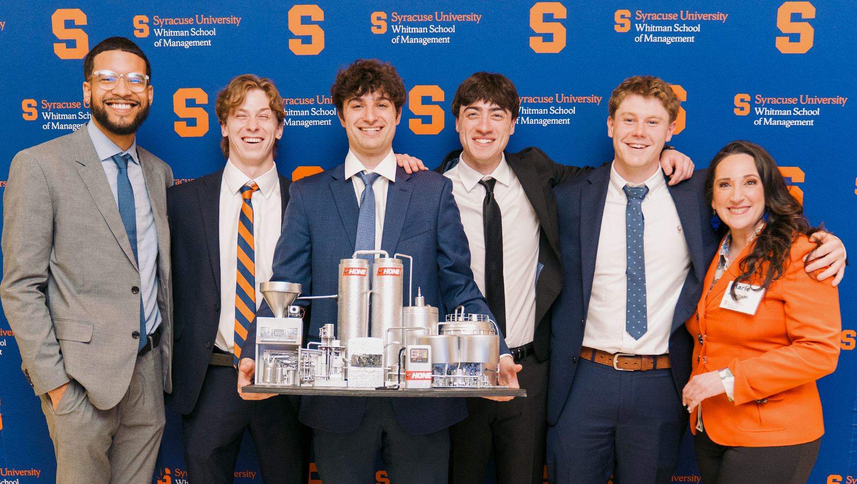 Winning Capstone team posing with Professor Adornato
