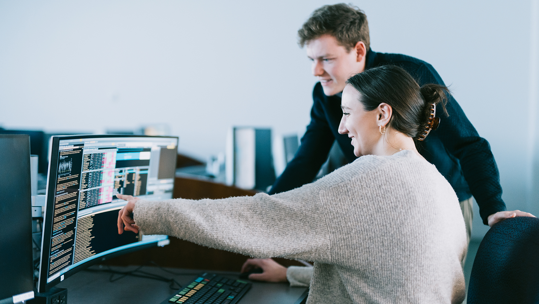 Two students looking at computer screen