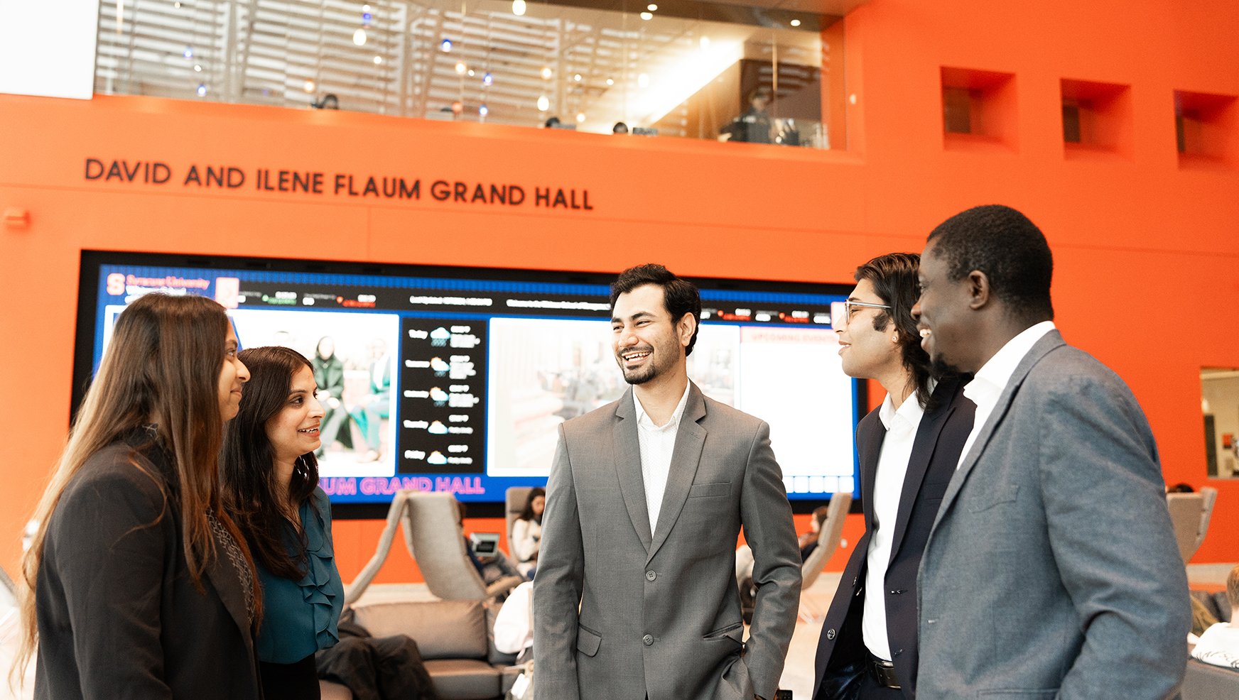 Graduate students in Flaum Grand Hall