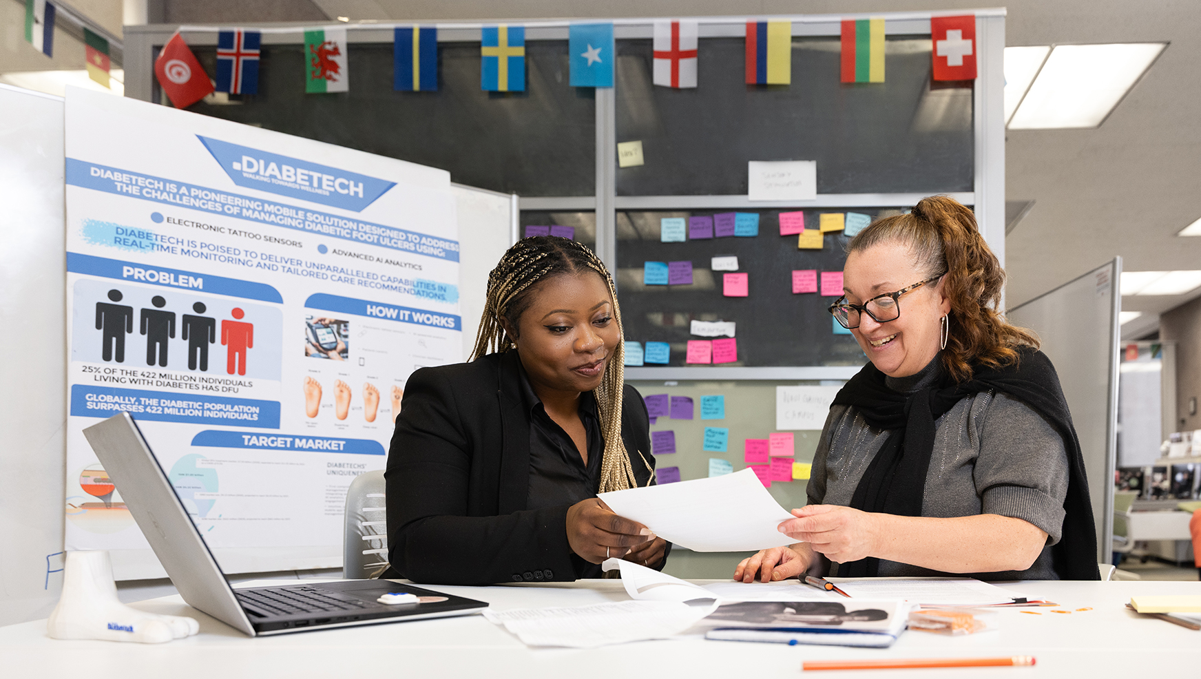Student getting help from staff at Blackstone Launchpad