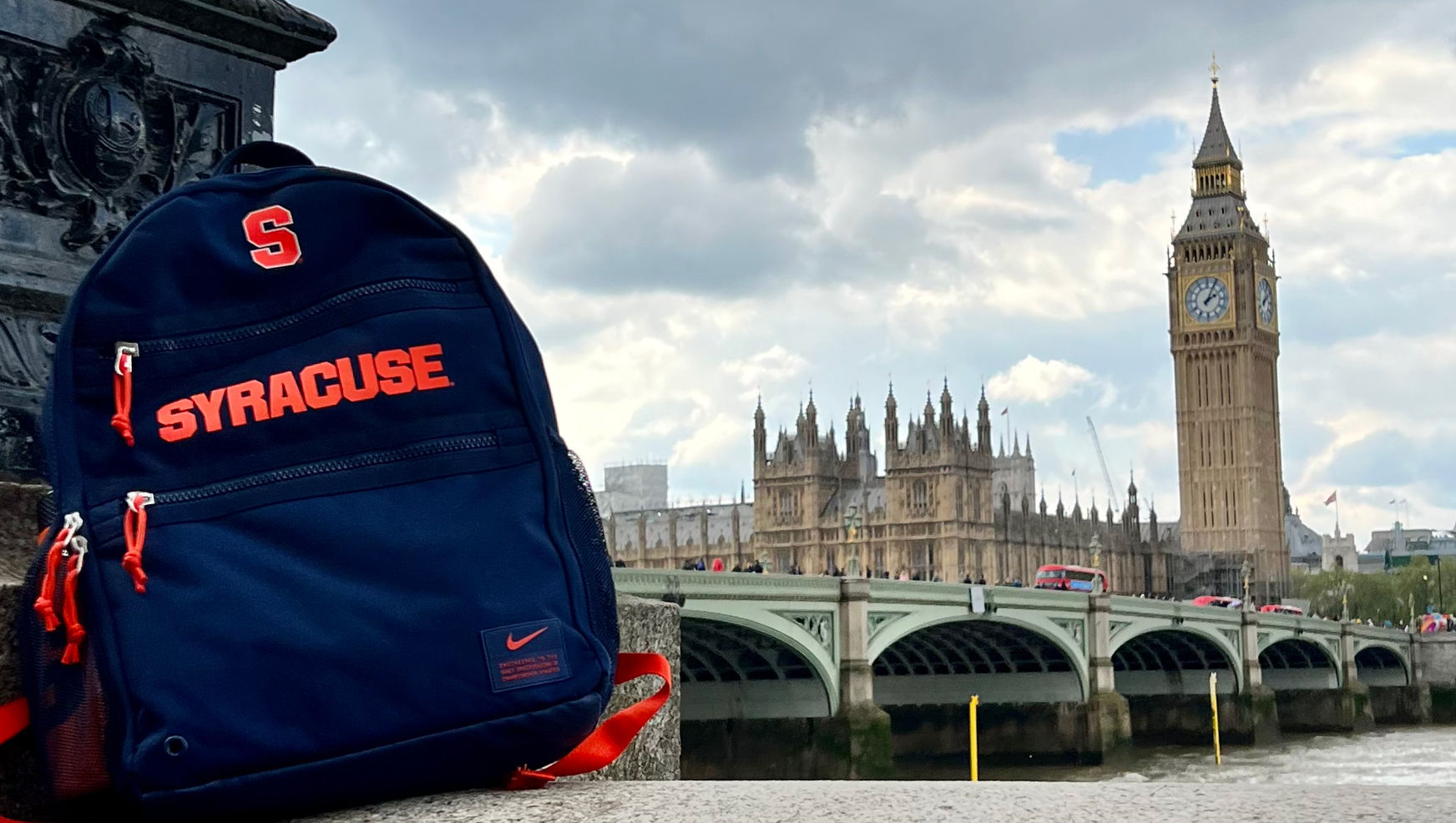 Syracuse University branded backpack with Big Ben in background