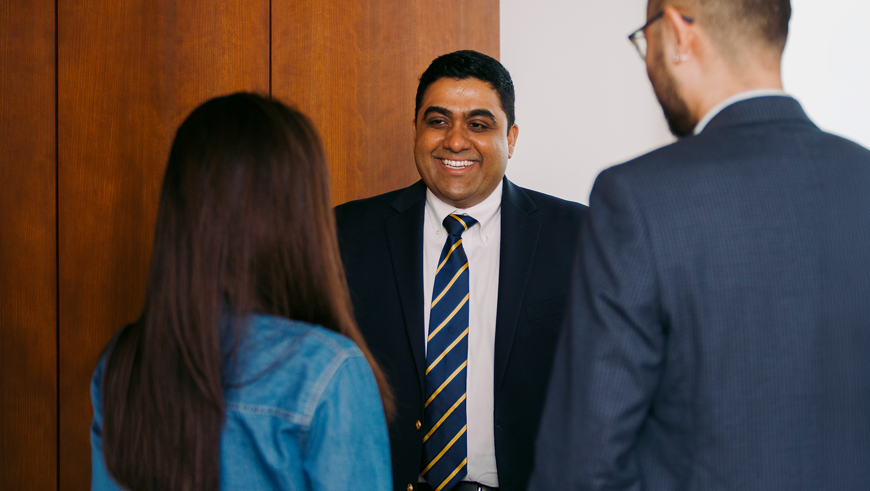 Anparasan Mahalingam speaking with colleagues