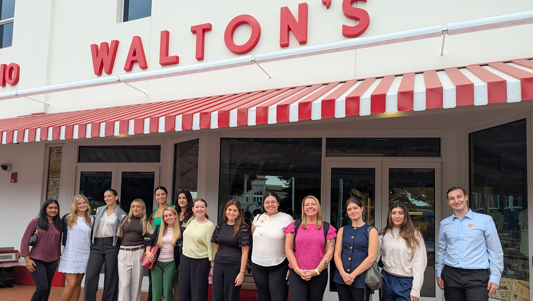 Students and Whitman staff pose outside Walton’s 5-10