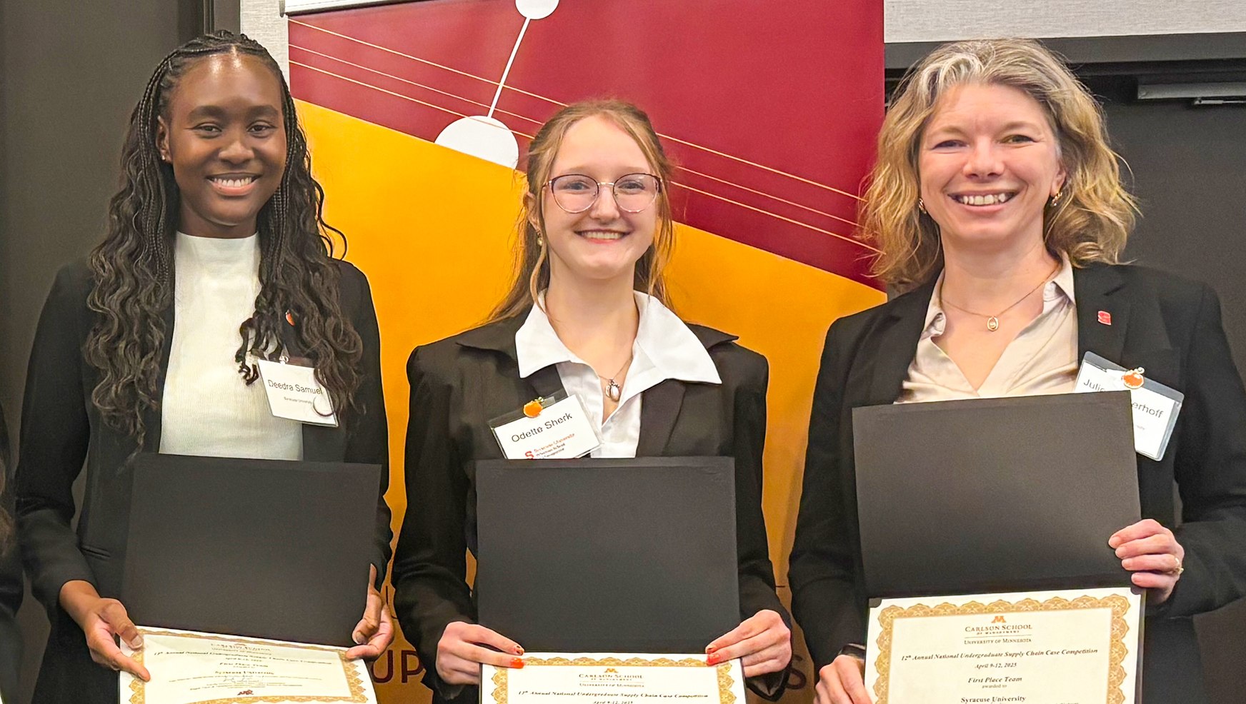 Deedra Samuel, Odetet Sherk and professor Niederhoff during an award ceremony