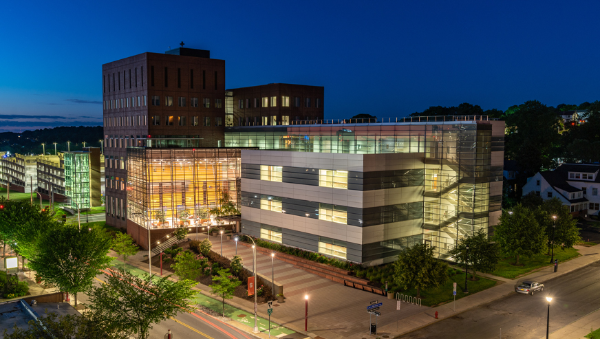 The Whitman School building in the evening