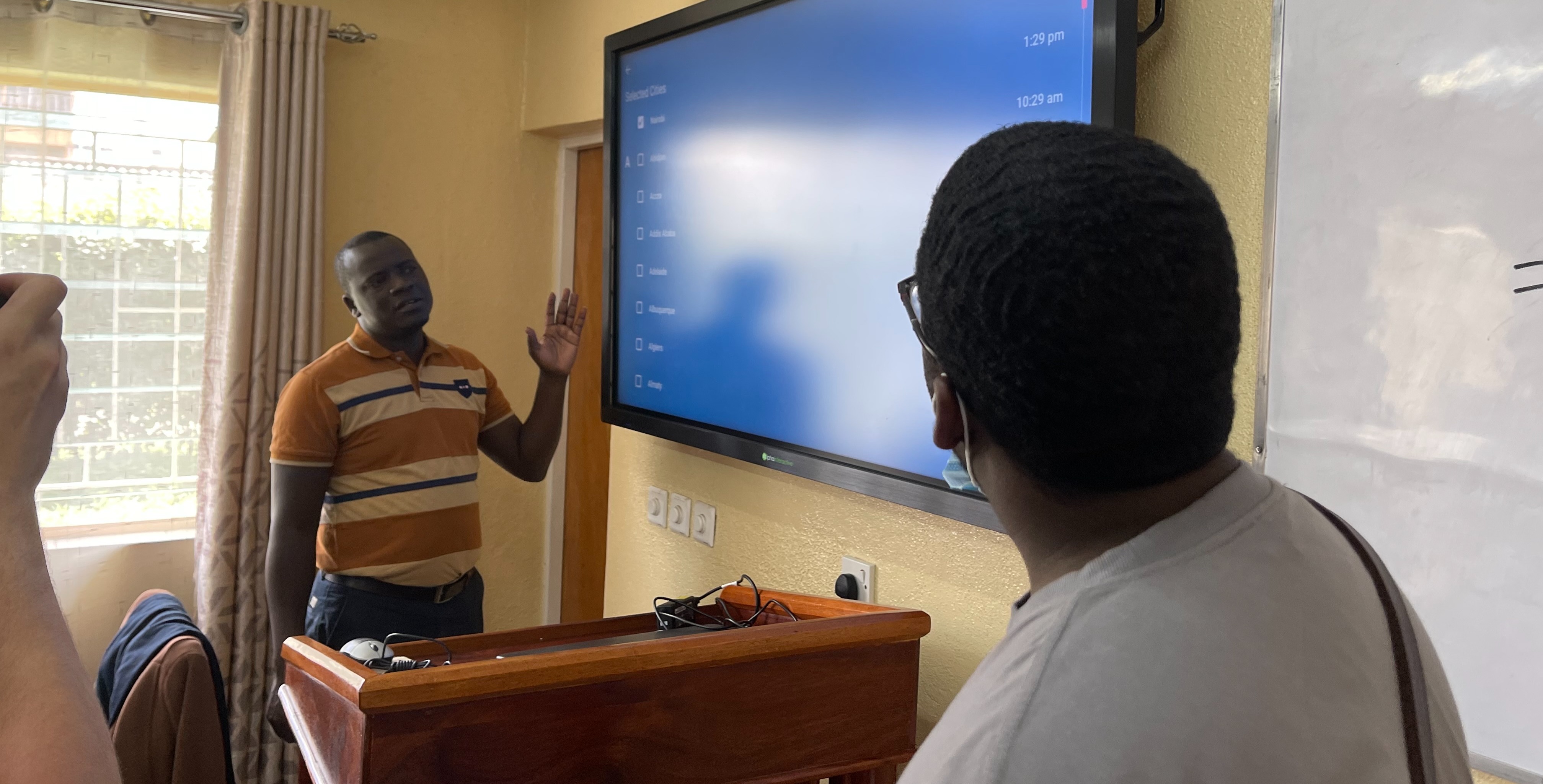 Jared in a classroom in Kenya