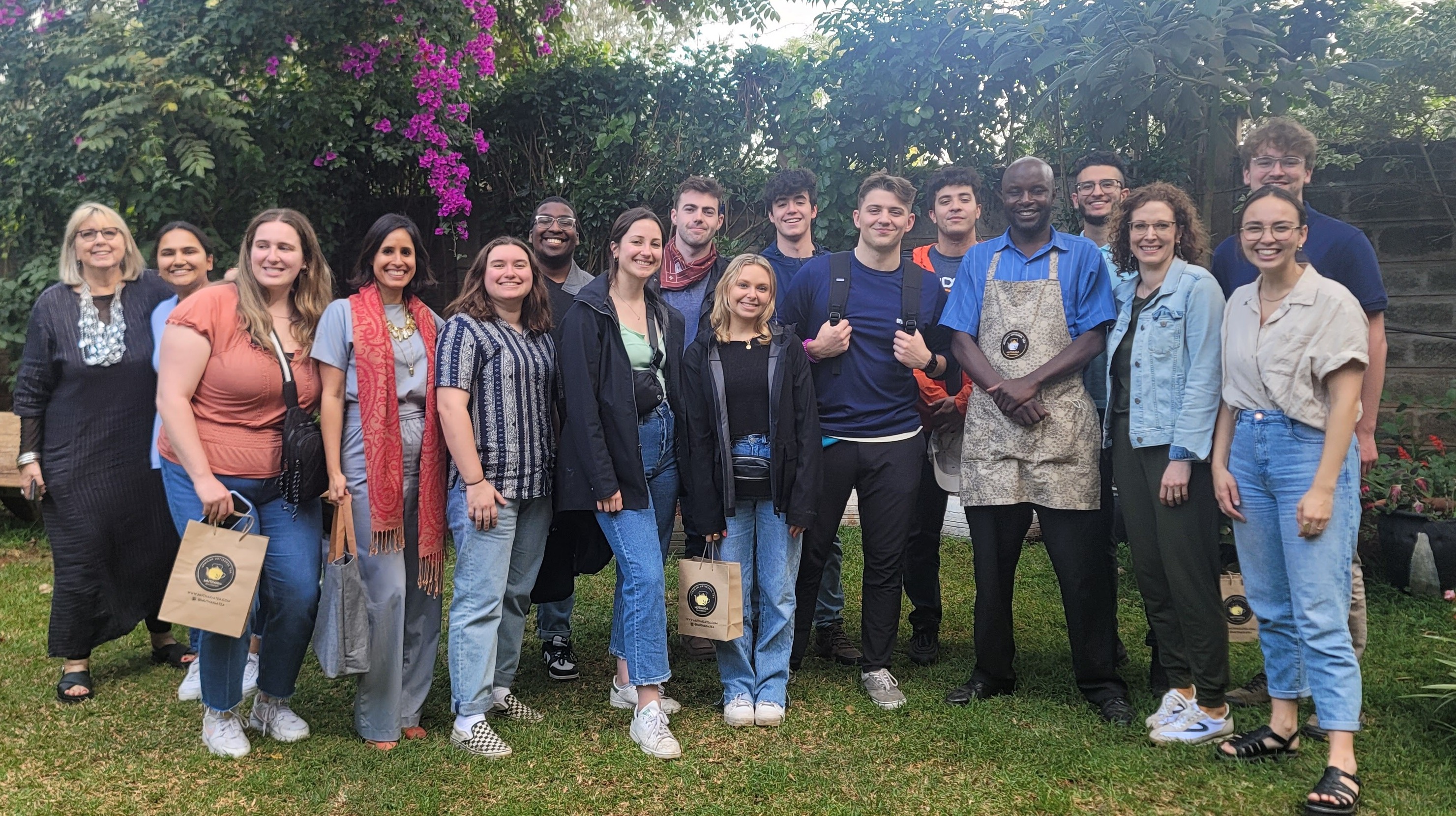 Group of Kenya travelers in a pretty garden