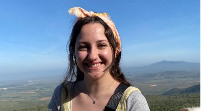 Student standing at an overlook in Kenya