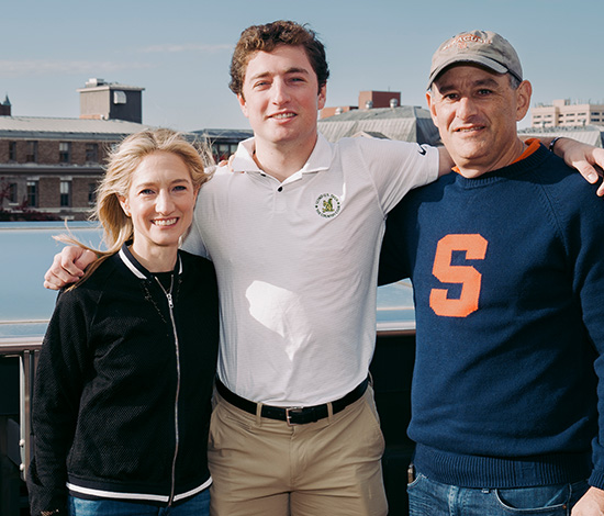 Alumni family posing on the Whitman terrace