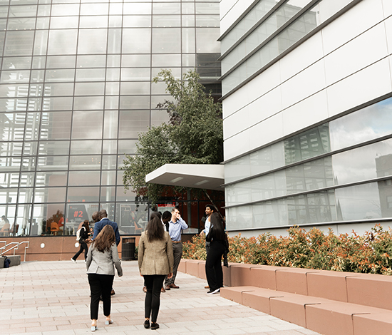 Students walking towards the Whitman School main entrance