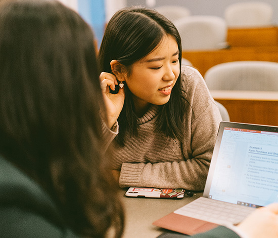 Two students working on a computer