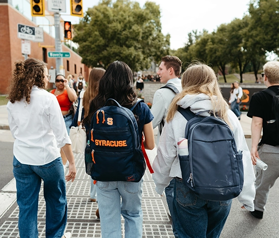 Students walking on campus crosswalk