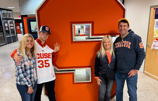 Aaron Krause, wife and two kids visit the Syracuse University campus