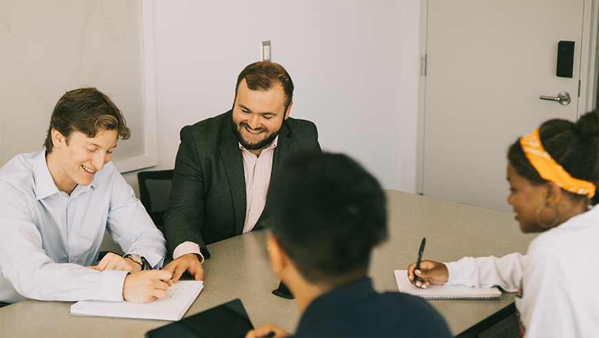 Professor meeting with students