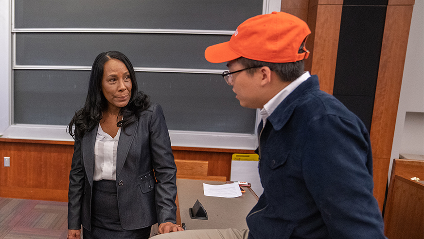 Diane Crawford talking with a student