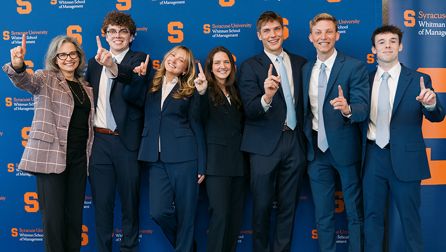 Professor Kostakis posing with the Spring 2025 winning Capstone team