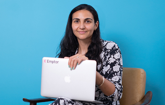 Oriana Fuentes with laptop on her lap