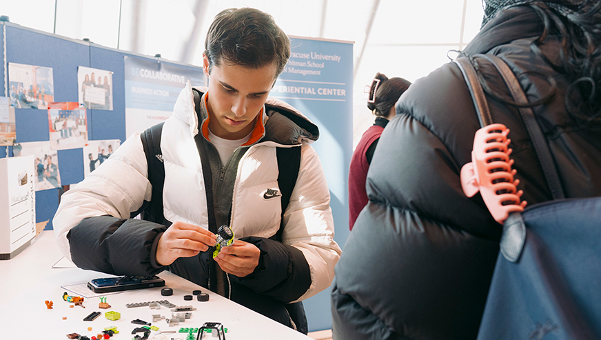Student exploring the Lego table